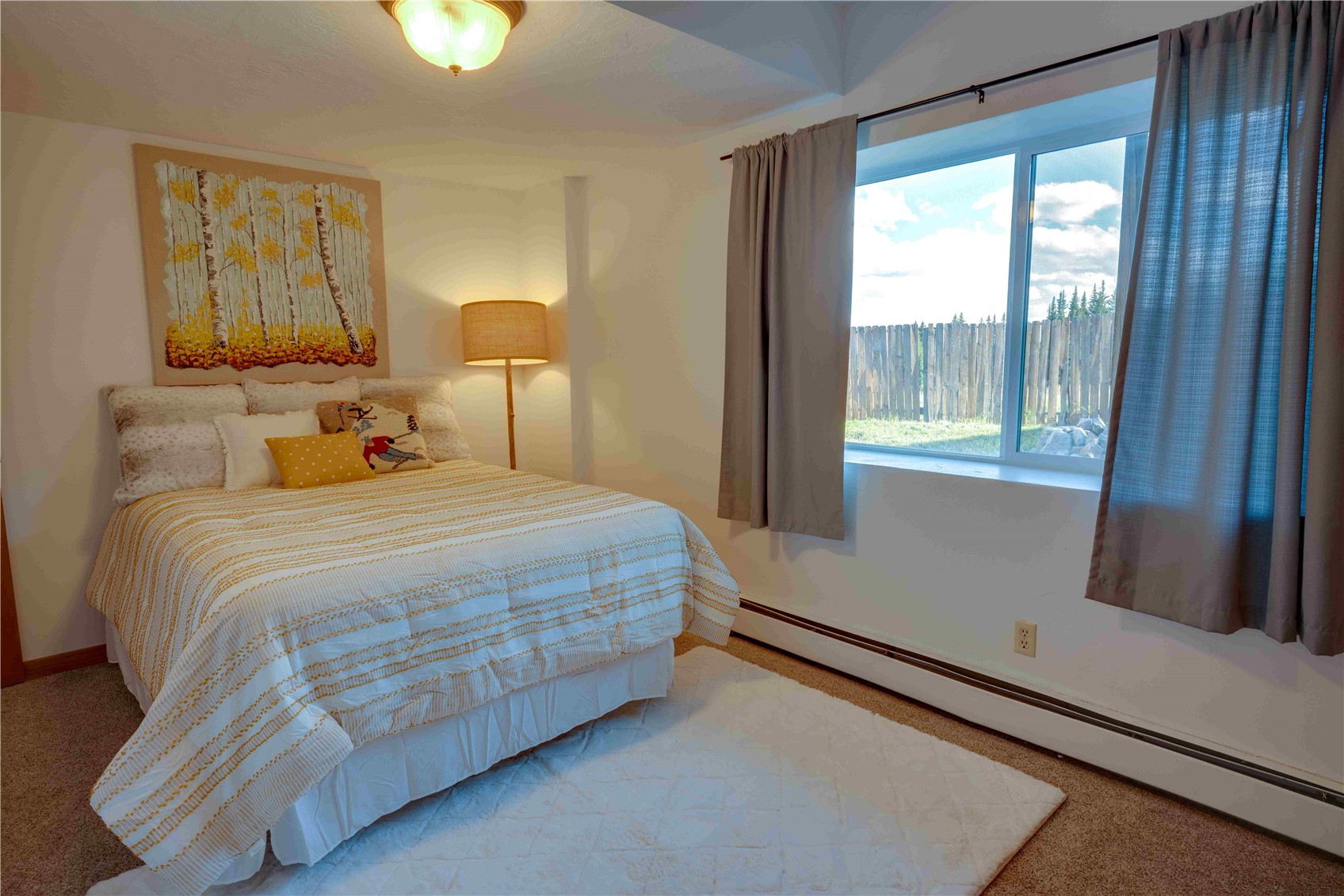746 Edgewood Road Alma, CO 80420 - Photo 21 of 32 Bedroom with carpet flooring, baseboard heating, and multiple windows