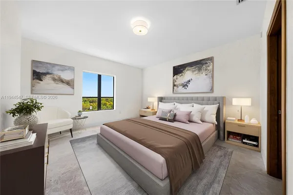 a bedroom with a bed and a couch