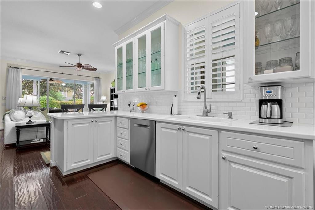 107 Castries Drive Jupiter, FL 33458 - Photo 16 of 39 a kitchen with a sink cabinets and window