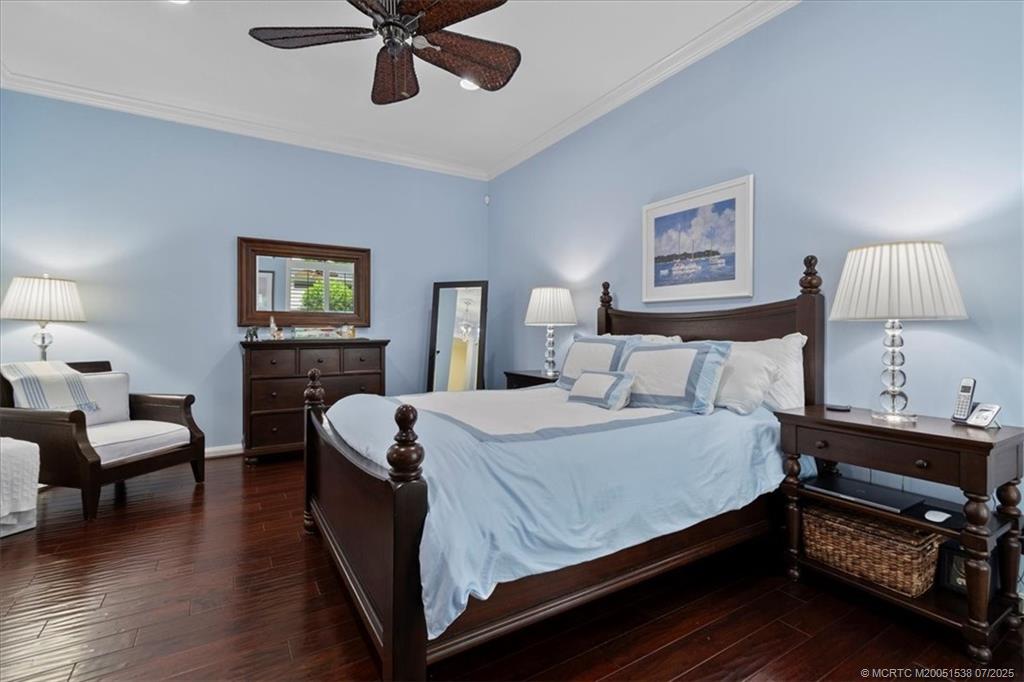 107 Castries Drive Jupiter, FL 33458 - Photo 19 of 39 a bed room with a bed and a lamp