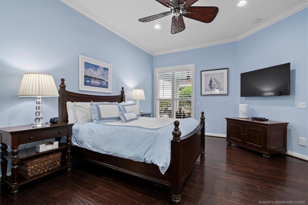 107 Castries Drive Jupiter, FL 33458 - Photo 20 of 39 a bedroom with a bed and a flat screen tv
