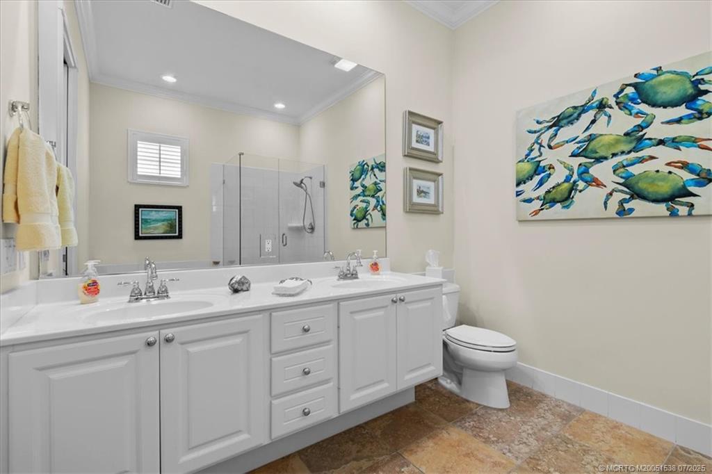 107 Castries Drive Jupiter, FL 33458 - Photo 22 of 39 a spacious bathroom with a double vanity sink mirror and vanity