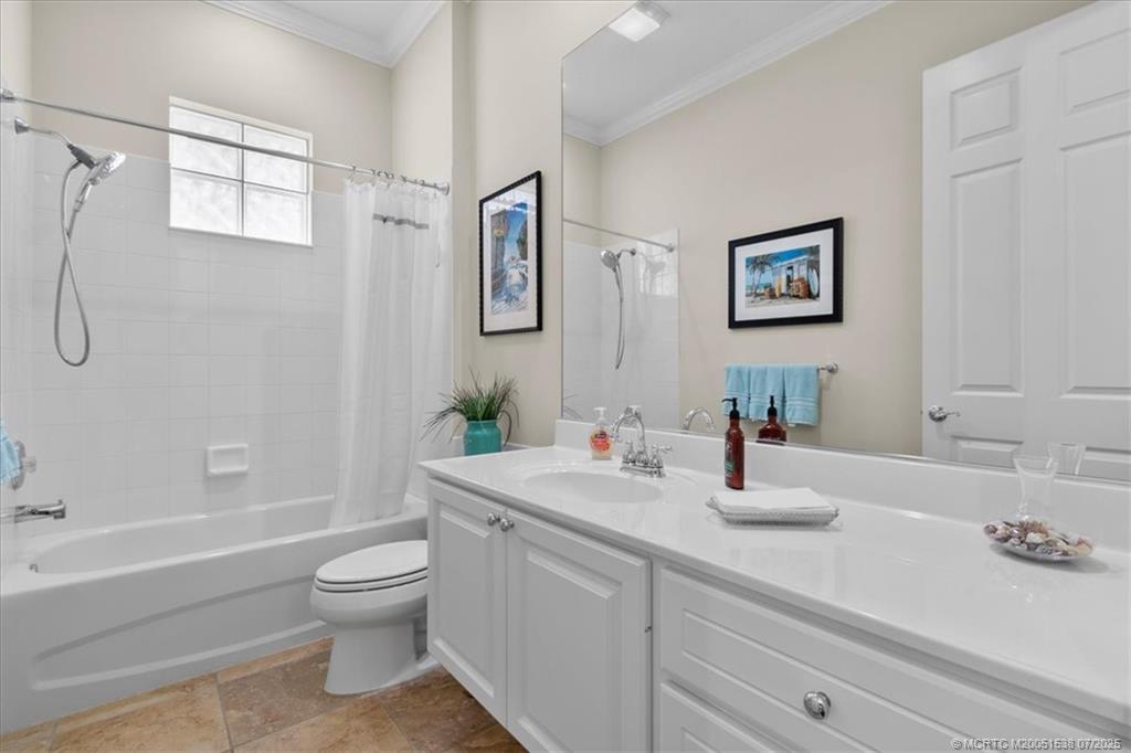 107 Castries Drive Jupiter, FL 33458 - Photo 25 of 39 a bathroom with a sink a toilet and shower