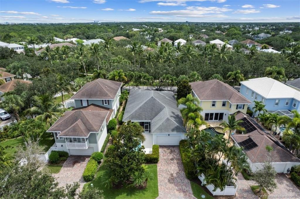 107 Castries Drive Jupiter, FL 33458 - Photo 31 of 39 an aerial view of multiple houses with a yard