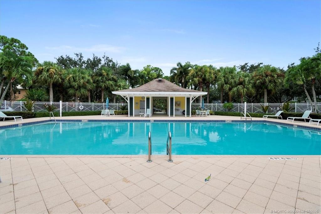 107 Castries Drive Jupiter, FL 33458 - Photo 36 of 39 a view of an chairs and tables in the yard