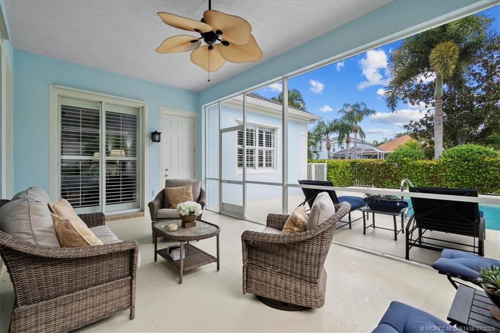 107 Castries Drive Jupiter, FL 33458 - Photo 5 of 39 a living room with furniture and a floor to ceiling window