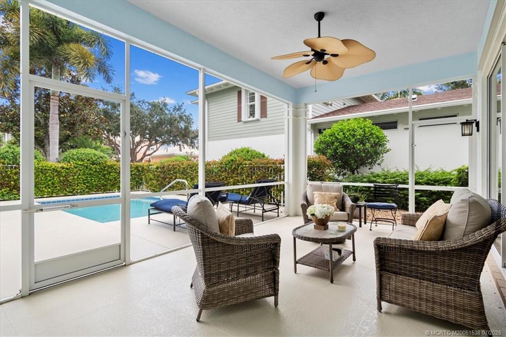 107 Castries Drive Jupiter, FL 33458 - Photo 6 of 39 a living room with furniture and a large window