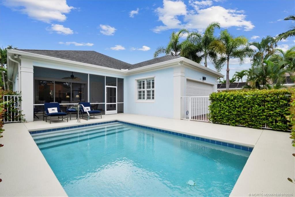 107 Castries Drive Jupiter, FL 33458 - Photo 7 of 39 a view of a backyard with plants and patio