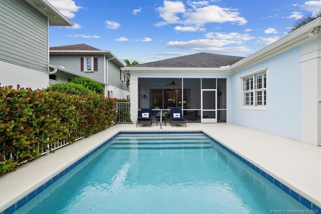 107 Castries Drive Jupiter, FL 33458 - Photo 8 of 39 a view of swimming pool with outdoor seating
