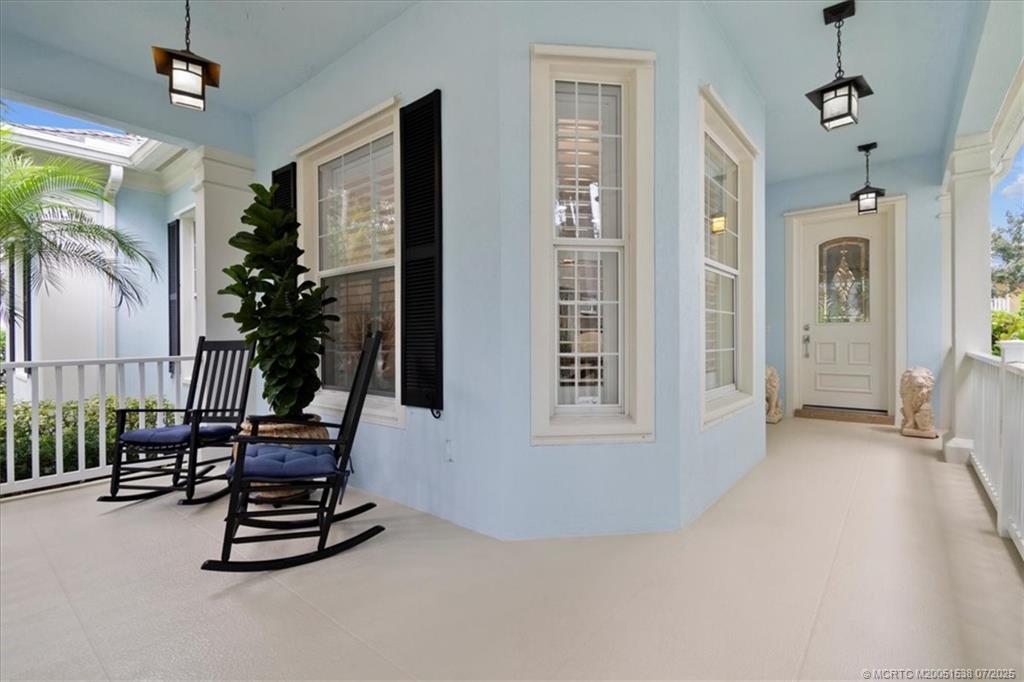 107 Castries Drive Jupiter, FL 33458 - Photo 9 of 39 a view of a livingroom with furniture and floor to ceiling window