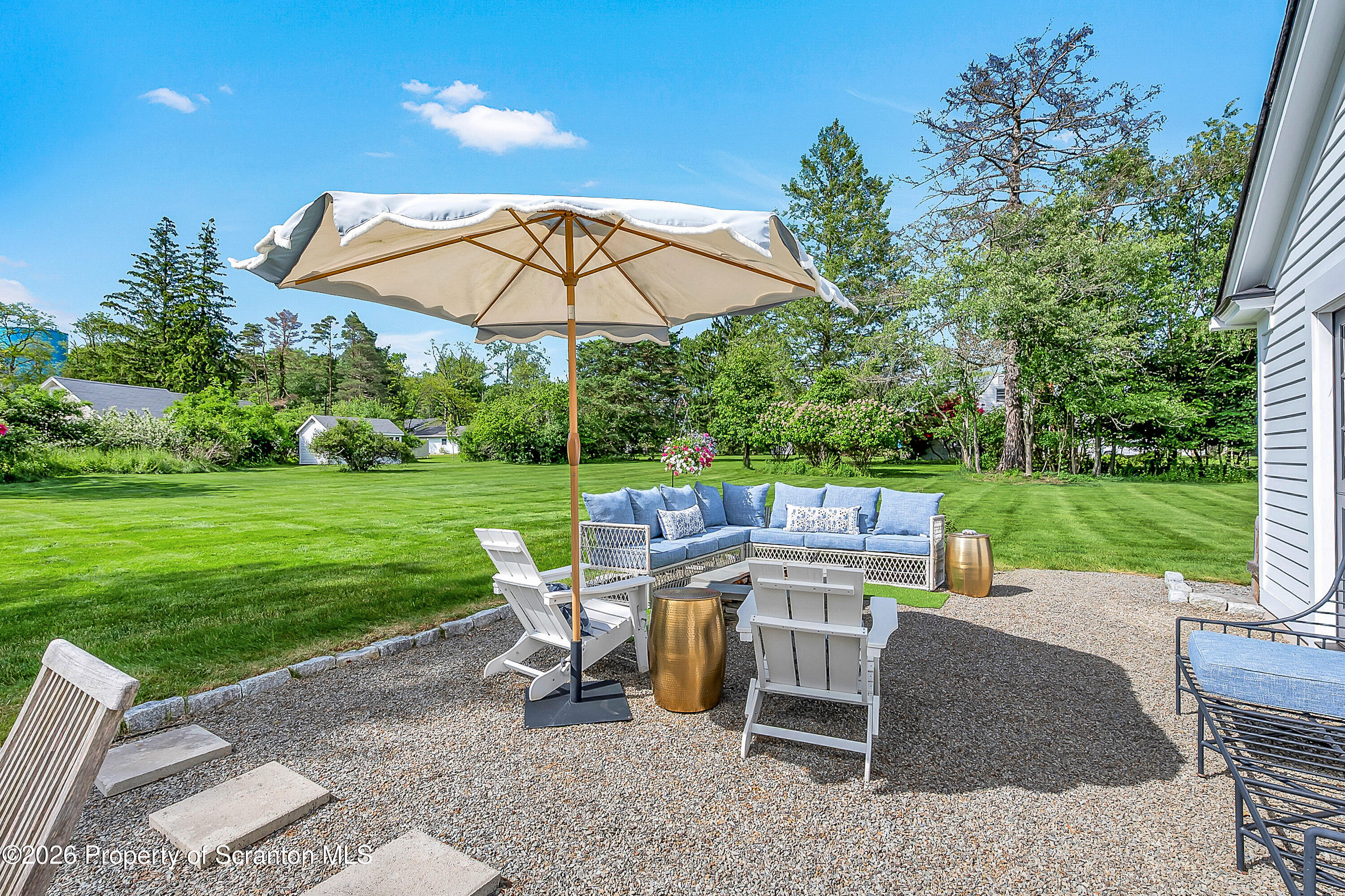 330 Glenburn Road Clarks Green, PA 18411 - Photo 11 of 69 a view of a tables and chairs under an umbrella
