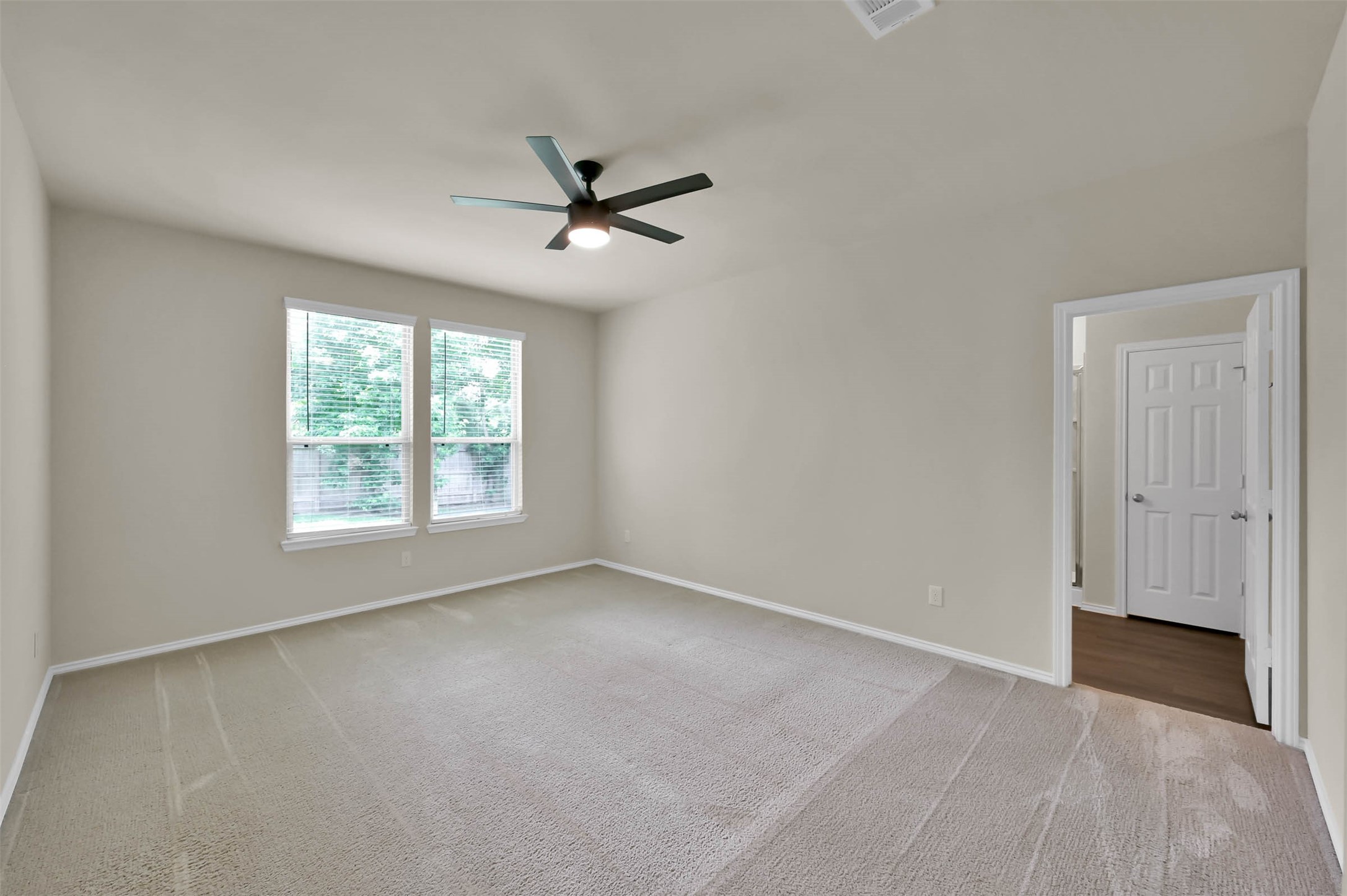 4231 Pine Still Road Conroe, TX 77304 - Photo 8 of 27 Welcome to the primary suite. Overlooking the backyard, wake up to the birds chirping and fresh sun!