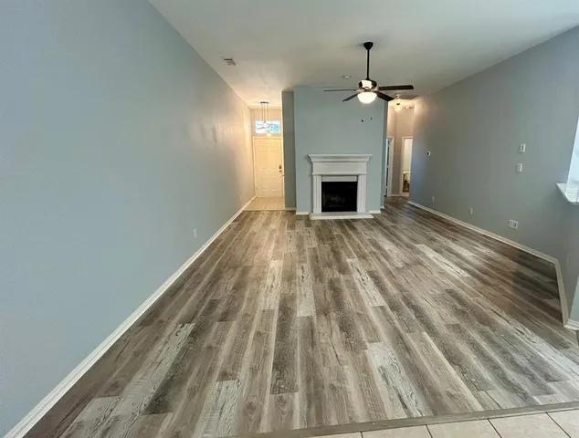 a view of empty room with fireplace