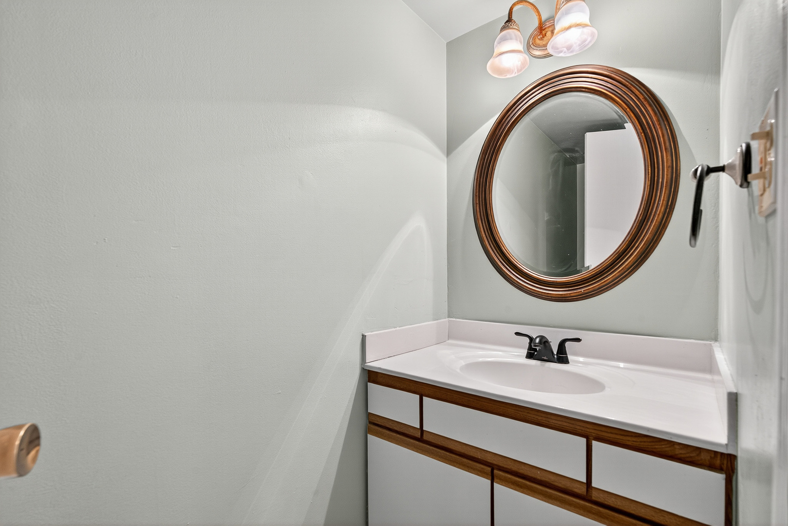 208 Bingham Circle Mundelein, IL 60060 - Photo 9 of 23 a bathroom with a sink and a mirror