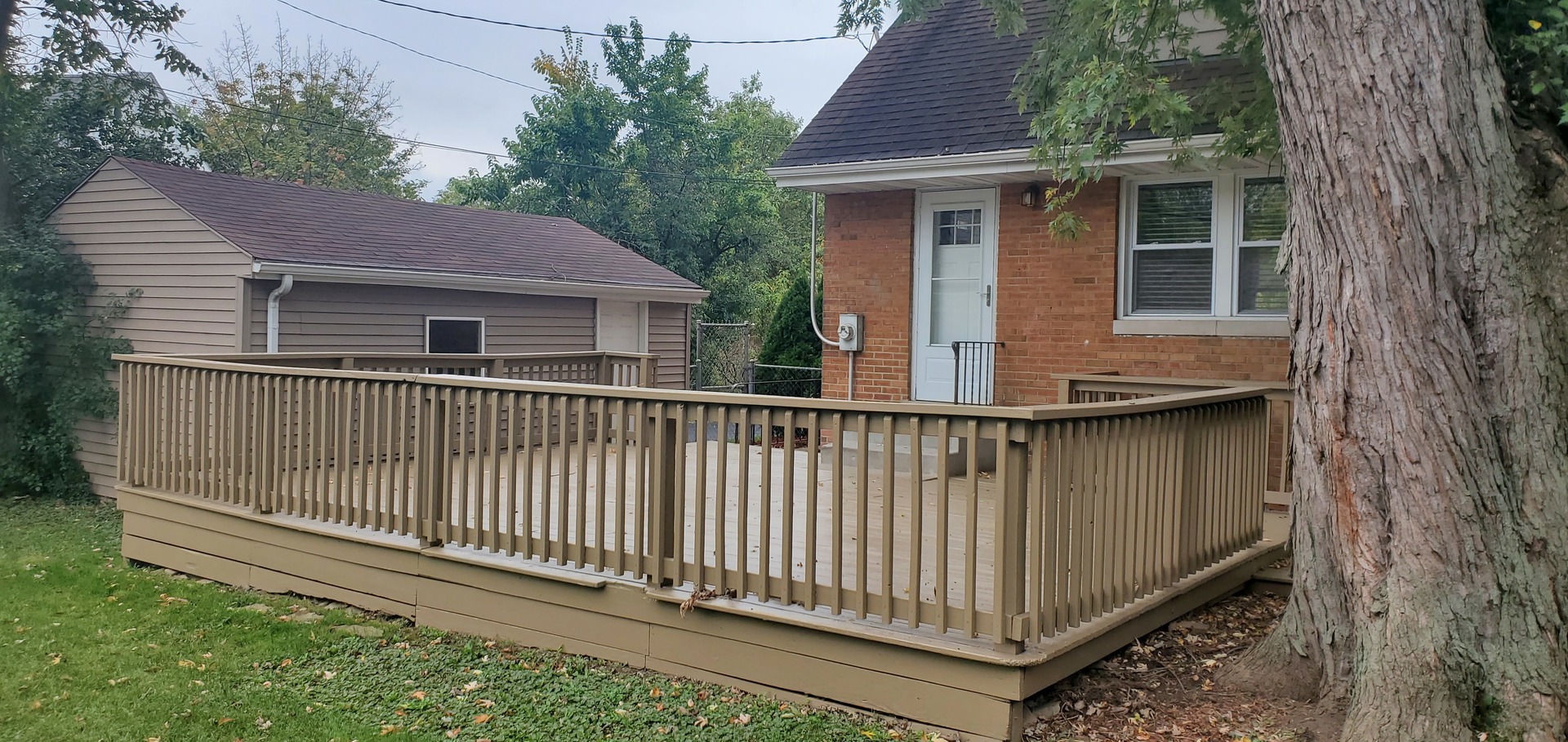 2212 Downey Road Homewood, IL 60430 - Photo 18 of 18 a view of a house with a small yard and wooden fence