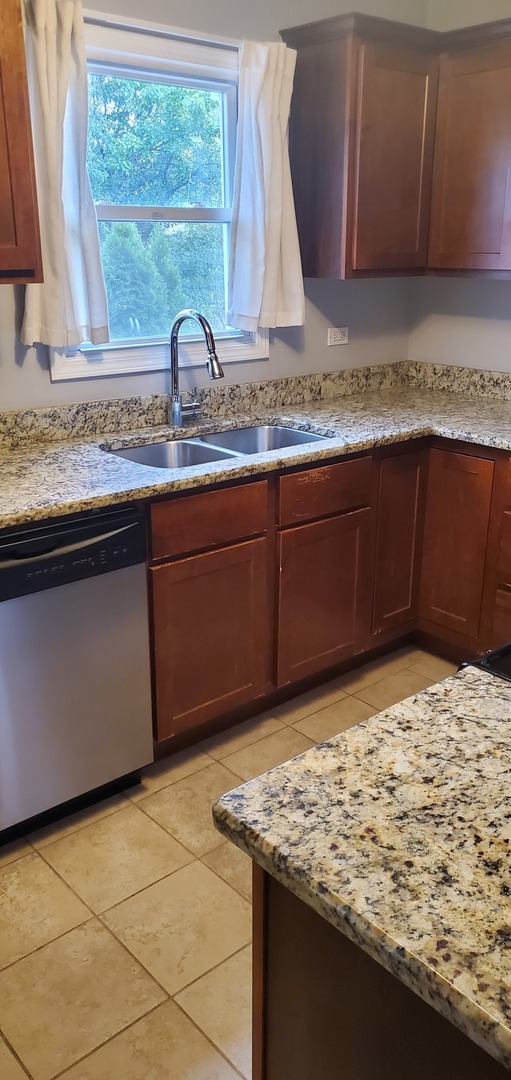 2212 Downey Road Homewood, IL 60430 - Photo 3 of 18 a kitchen with granite countertop cabinets and window