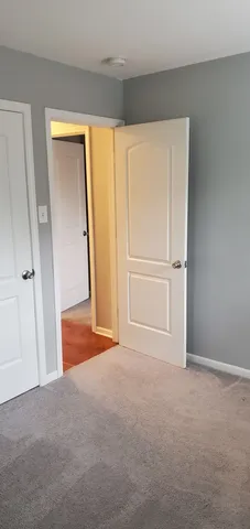 an empty room with closet area