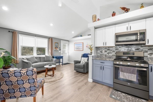 16 Hazelwood Road Dennis, MA 02660 - Photo 11 of 40 a kitchen with furniture a stove a sink and a microwave