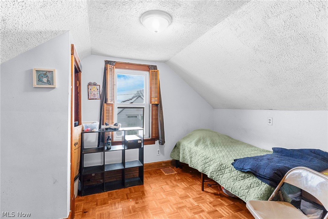 464 Elm Street Struthers, OH 44471 - Photo 19 of 22 Bedroom with parquet floors and a textured ceiling