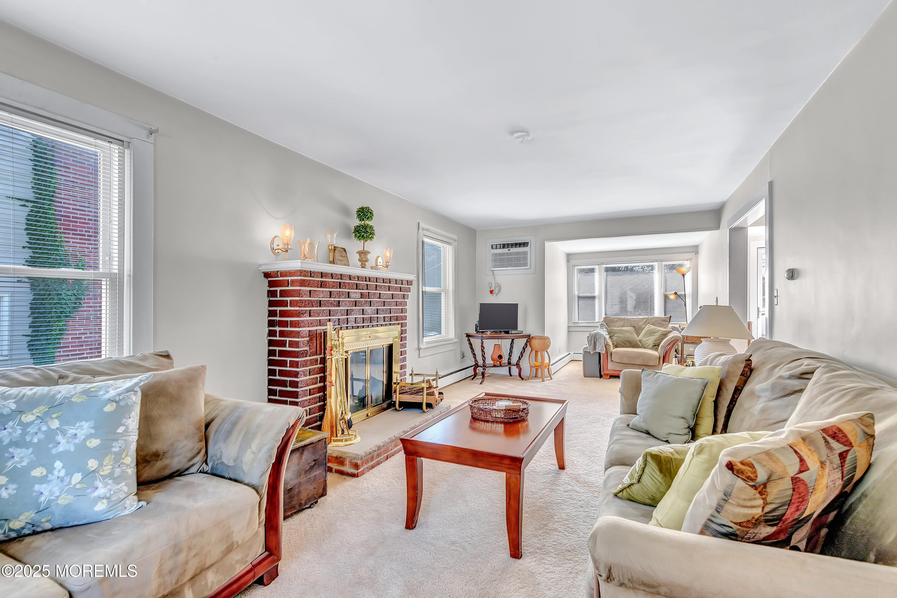 390 Conover Place Red Bank, NJ 07701 - Photo 12 of 39 a living room with furniture a fireplace and a window