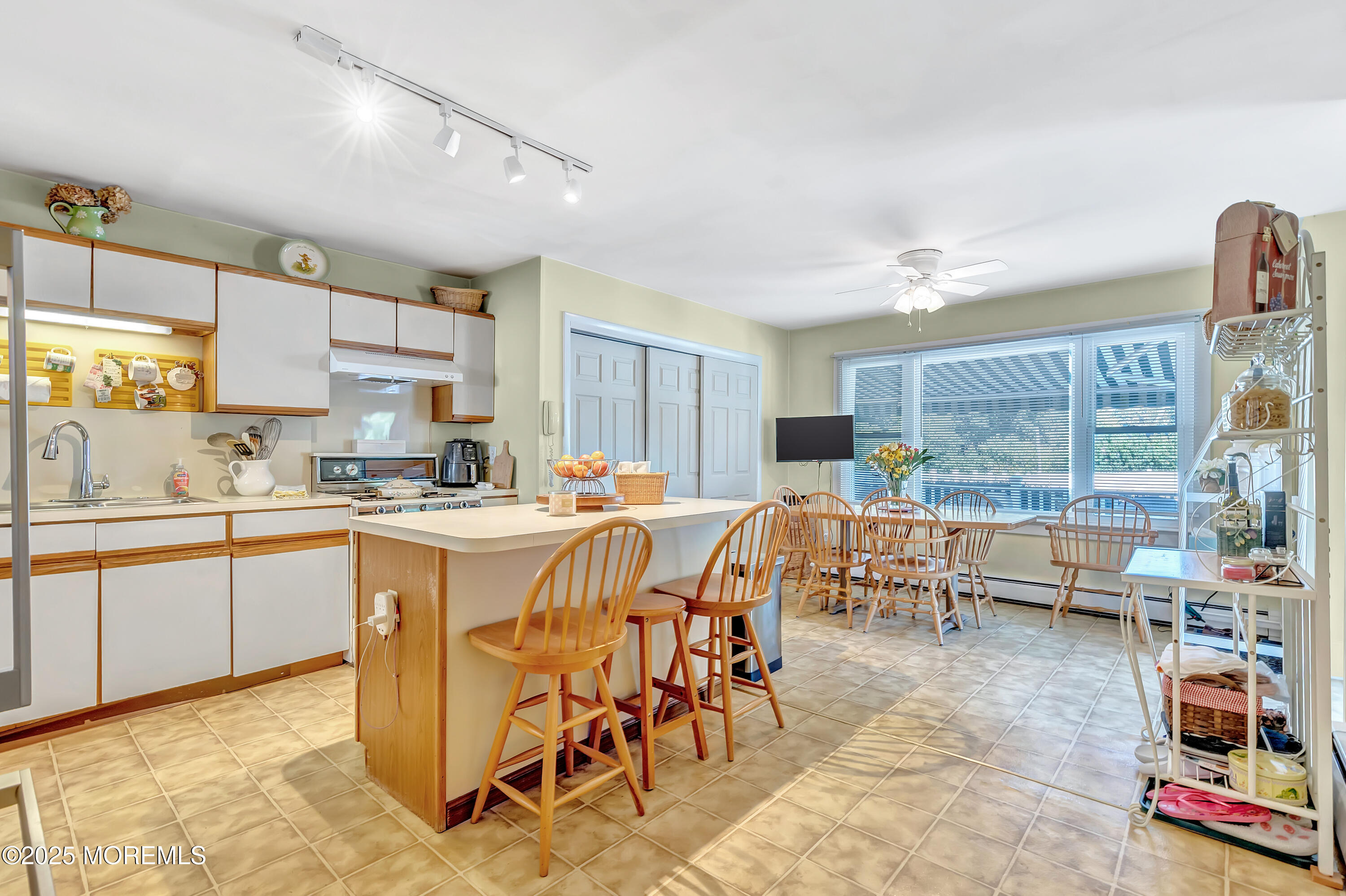 390 Conover Place Red Bank, NJ 07701 - Photo 13 of 39 a kitchen with stainless steel appliances kitchen island granite countertop a sink and cabinets