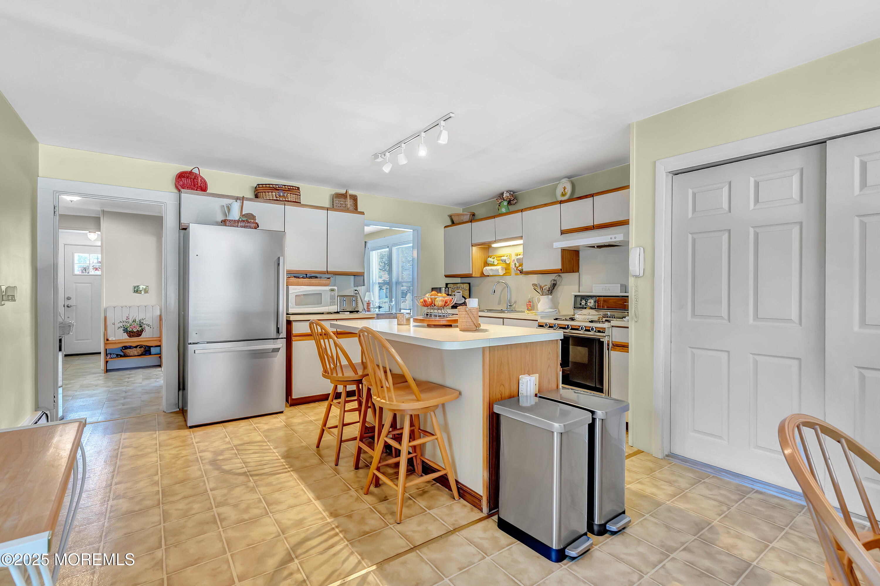 390 Conover Place Red Bank, NJ 07701 - Photo 14 of 39 a kitchen with a refrigerator a stove and a sink