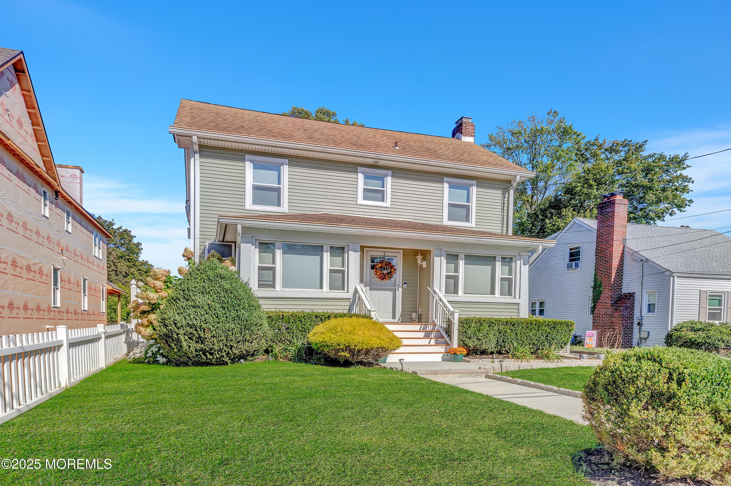 390 Conover Place Red Bank, NJ 07701 - Photo 2 of 39 a front view of a house with a garden
