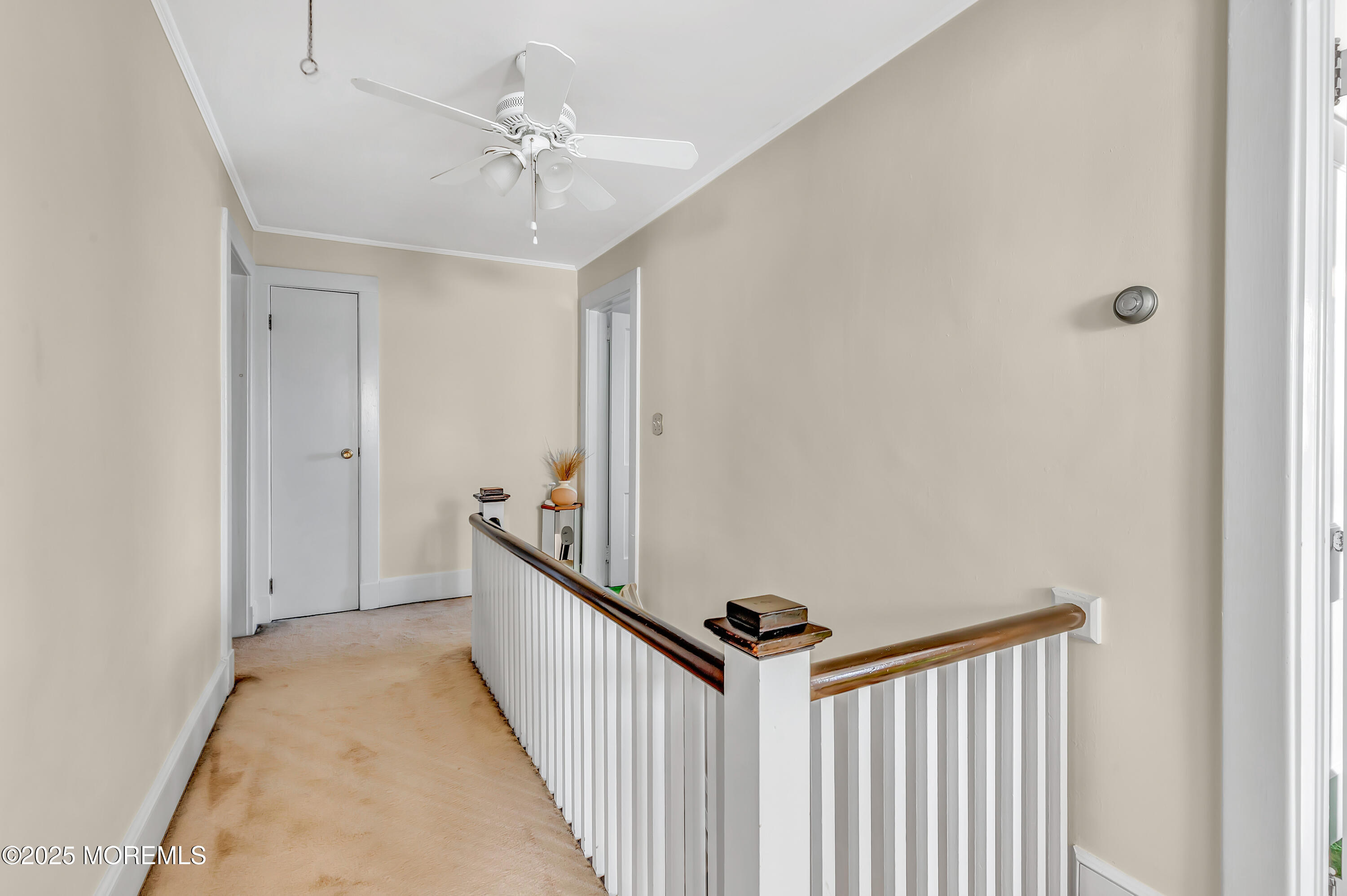 390 Conover Place Red Bank, NJ 07701 - Photo 22 of 39 a view of a hallway with a chandelier fan