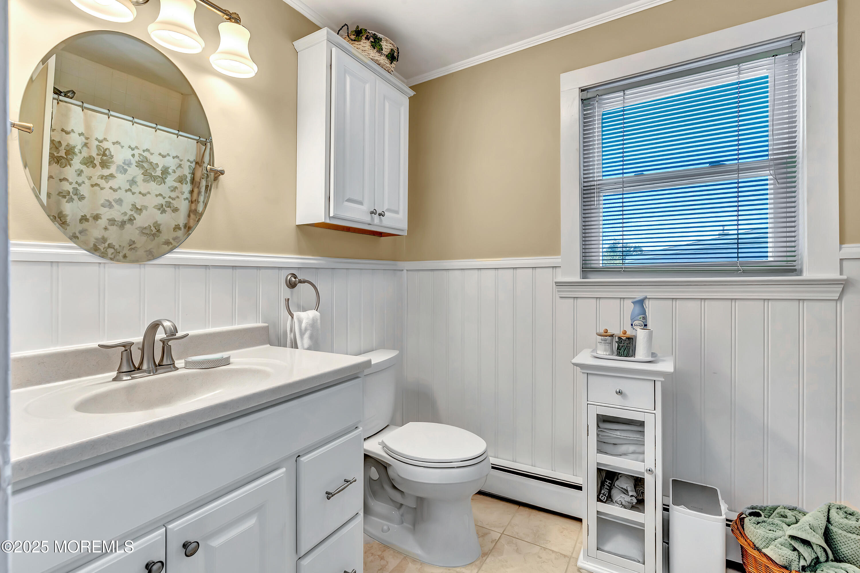 390 Conover Place Red Bank, NJ 07701 - Photo 24 of 39 a bathroom with a toilet a sink and mirror