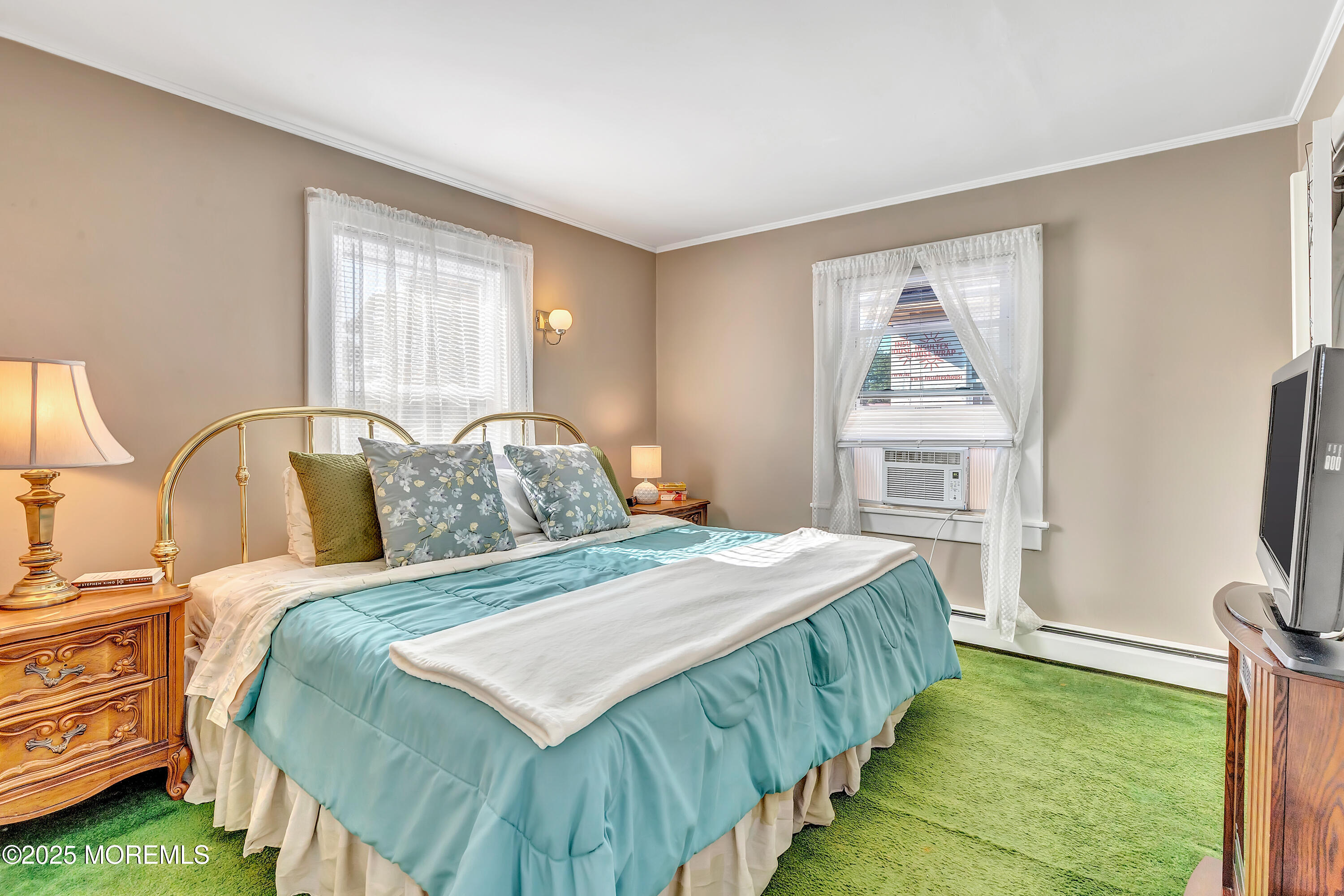 390 Conover Place Red Bank, NJ 07701 - Photo 25 of 39 a bedroom with a bed and a flat screen tv