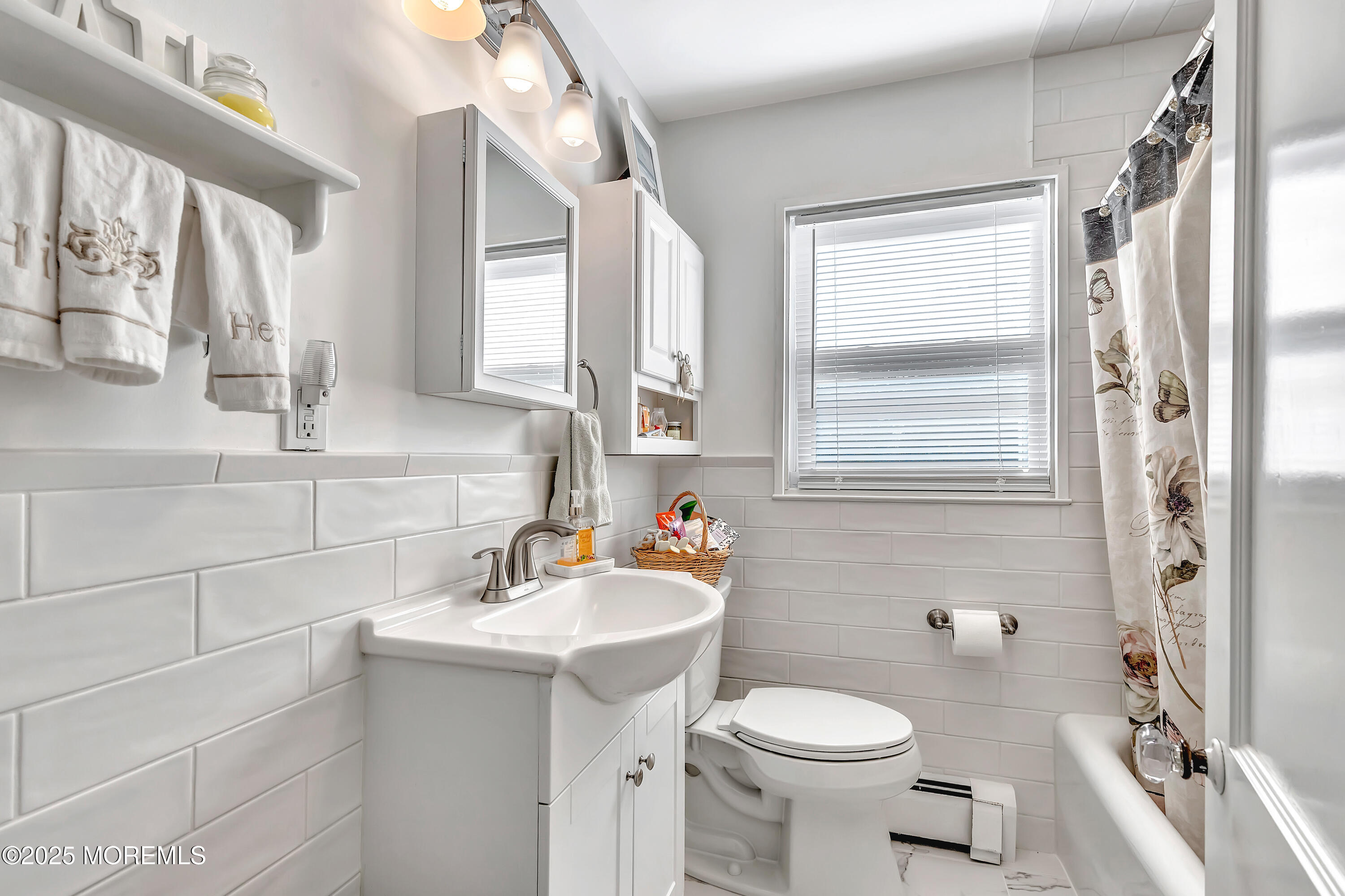 390 Conover Place Red Bank, NJ 07701 - Photo 28 of 39 a bathroom with a sink toilet and shower