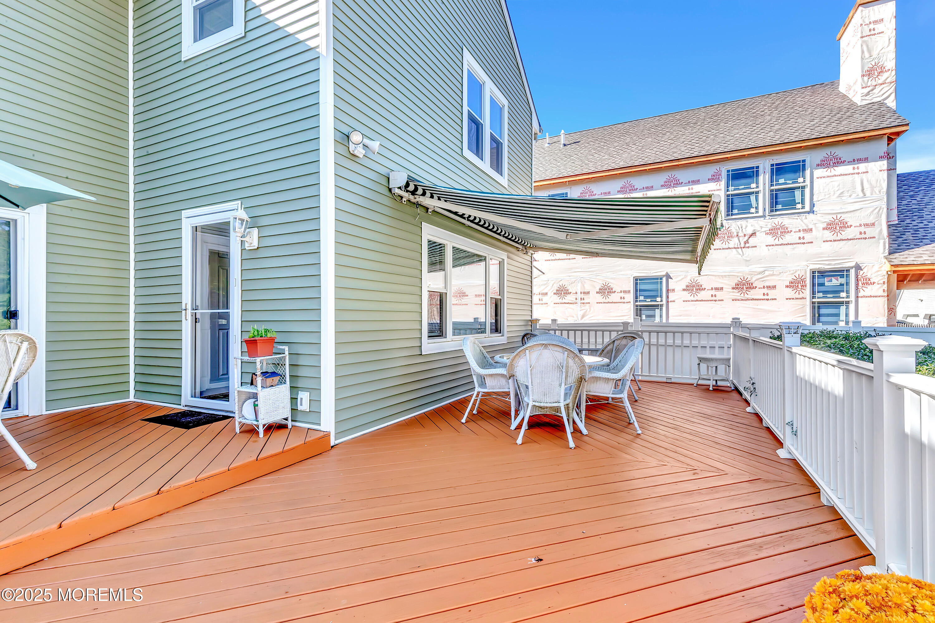 390 Conover Place Red Bank, NJ 07701 - Photo 32 of 39 a wooden bench sitting on top of a wooden deck