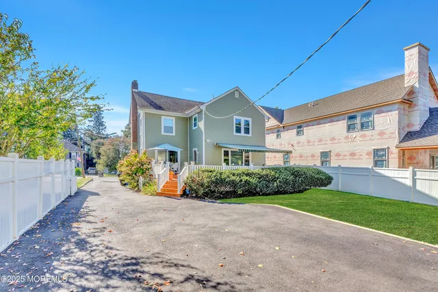 a view of a house with a flower garden