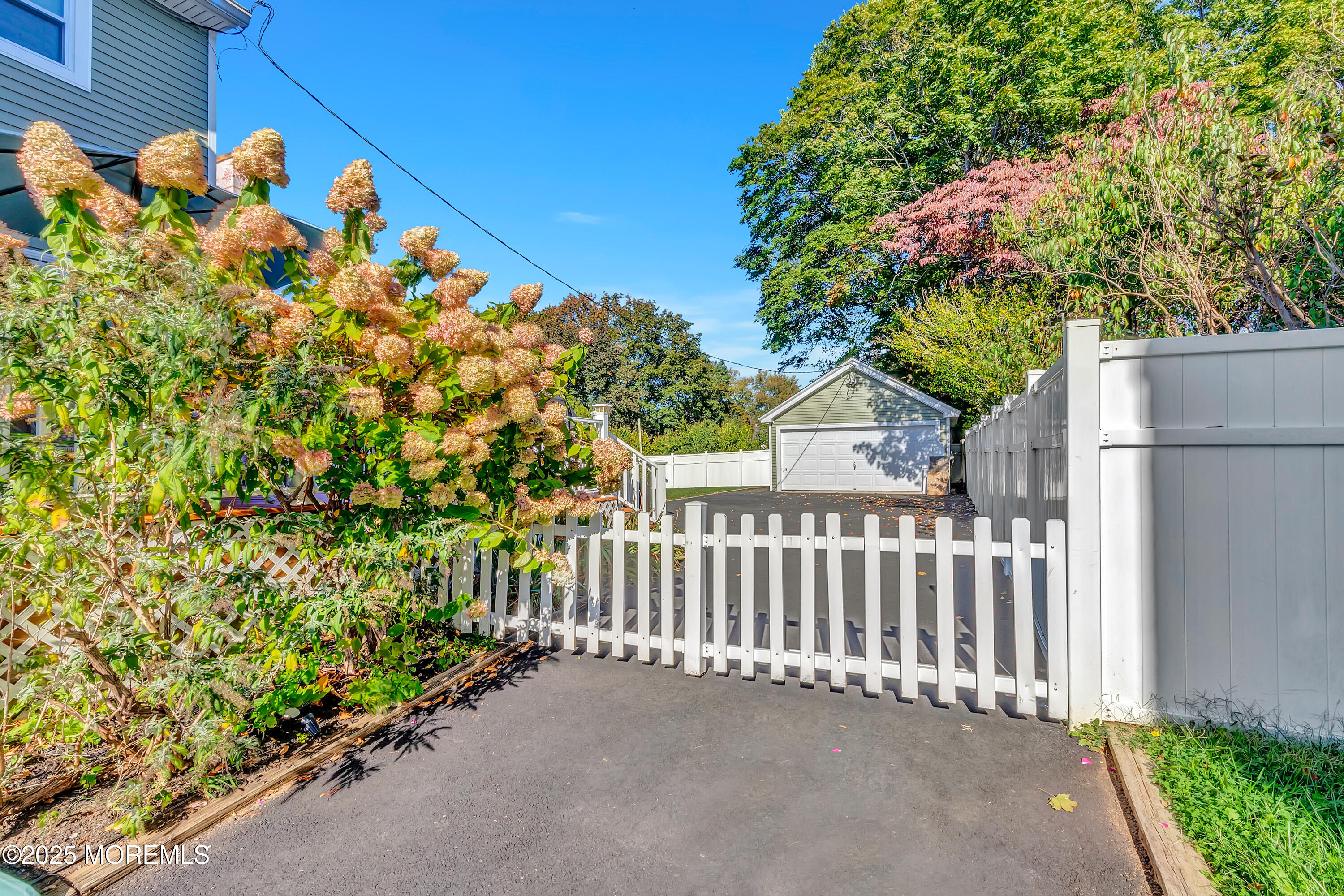 390 Conover Place Red Bank, NJ 07701 - Photo 39 of 39 a view of a house with a flower garden