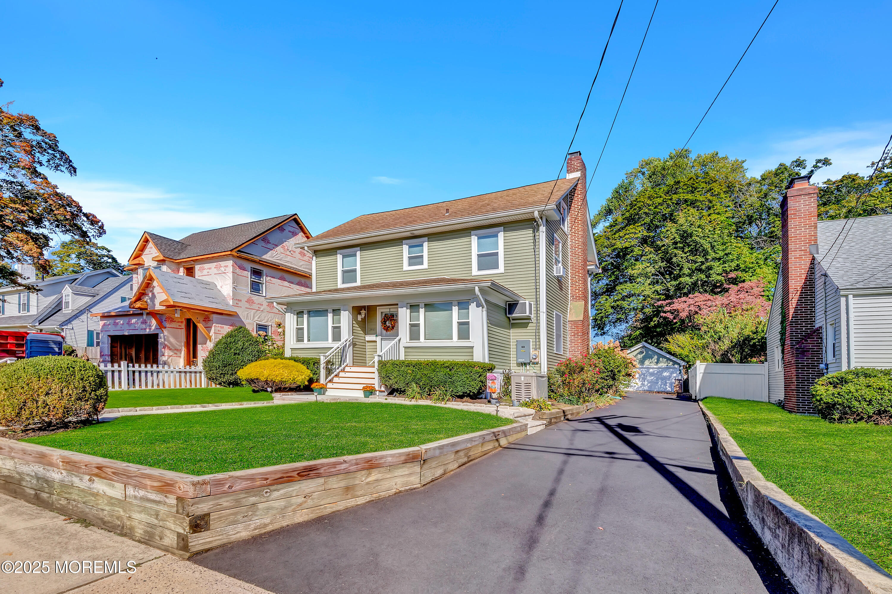 390 Conover Place Red Bank, NJ 07701 - Photo 6 of 39 a front view of a house with a yard and potted plants