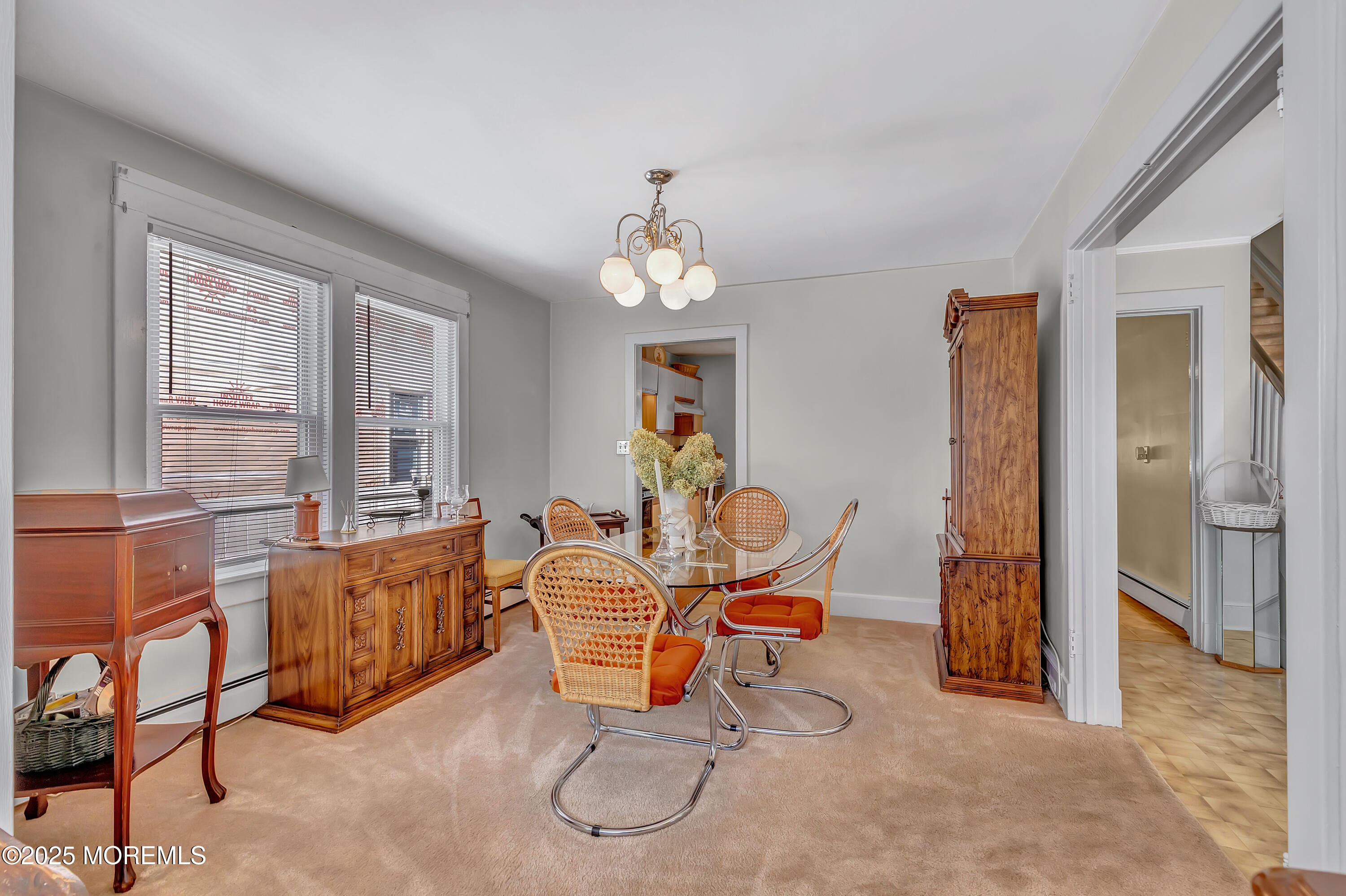 390 Conover Place Red Bank, NJ 07701 - Photo 8 of 39 a living room with furniture a chandelier and a window