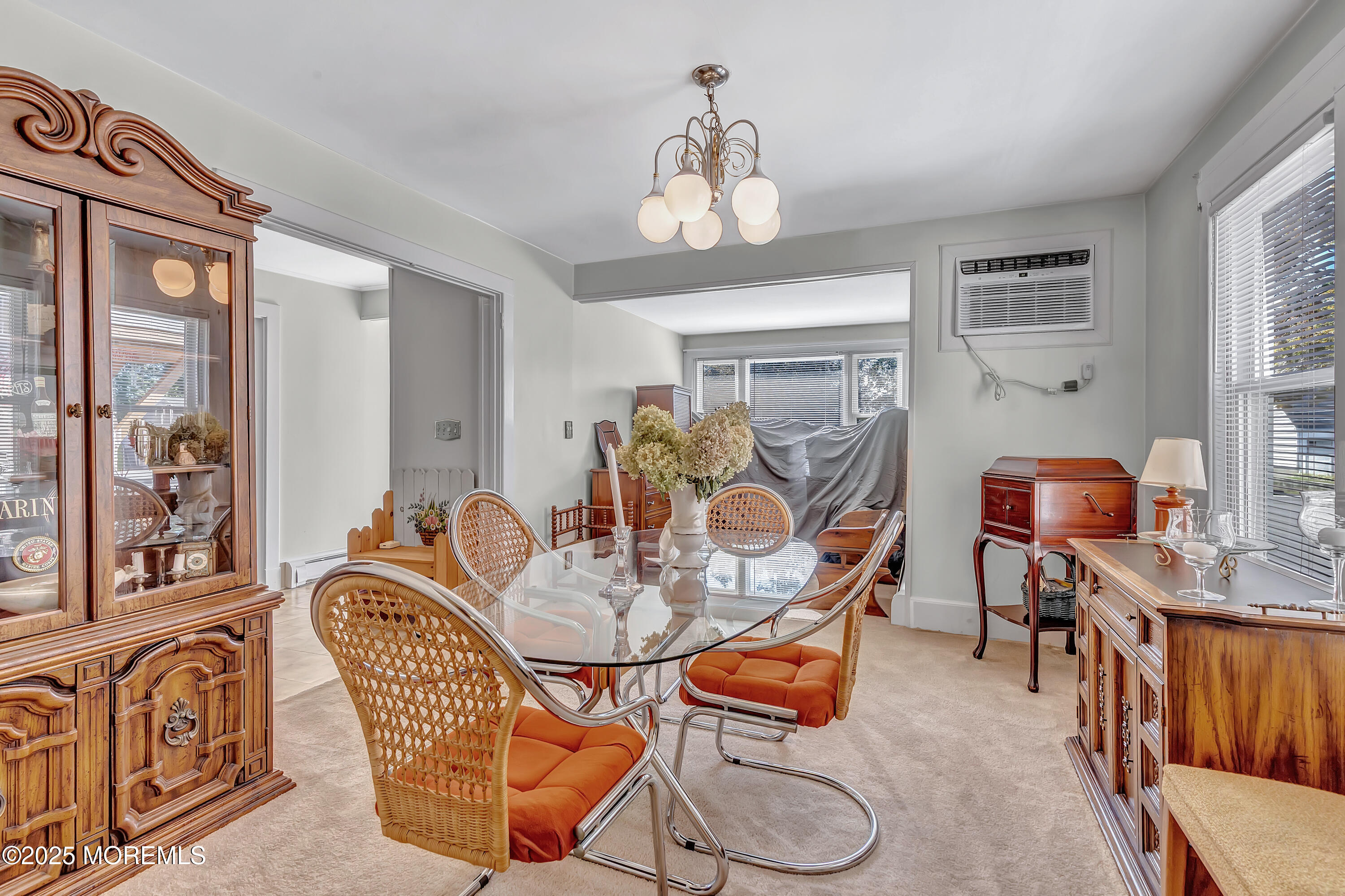 390 Conover Place Red Bank, NJ 07701 - Photo 9 of 39 a dining room with furniture a chandelier and wooden floor