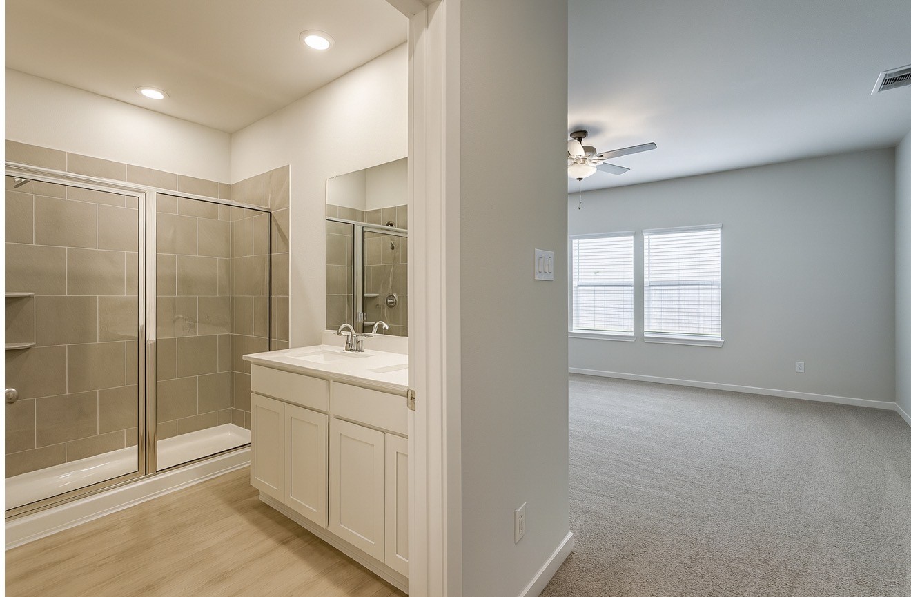 3914 Flora Fld Drive Brookshire, TX 77423 - Photo 11 of 32 a bathroom with a shower sink and mirror