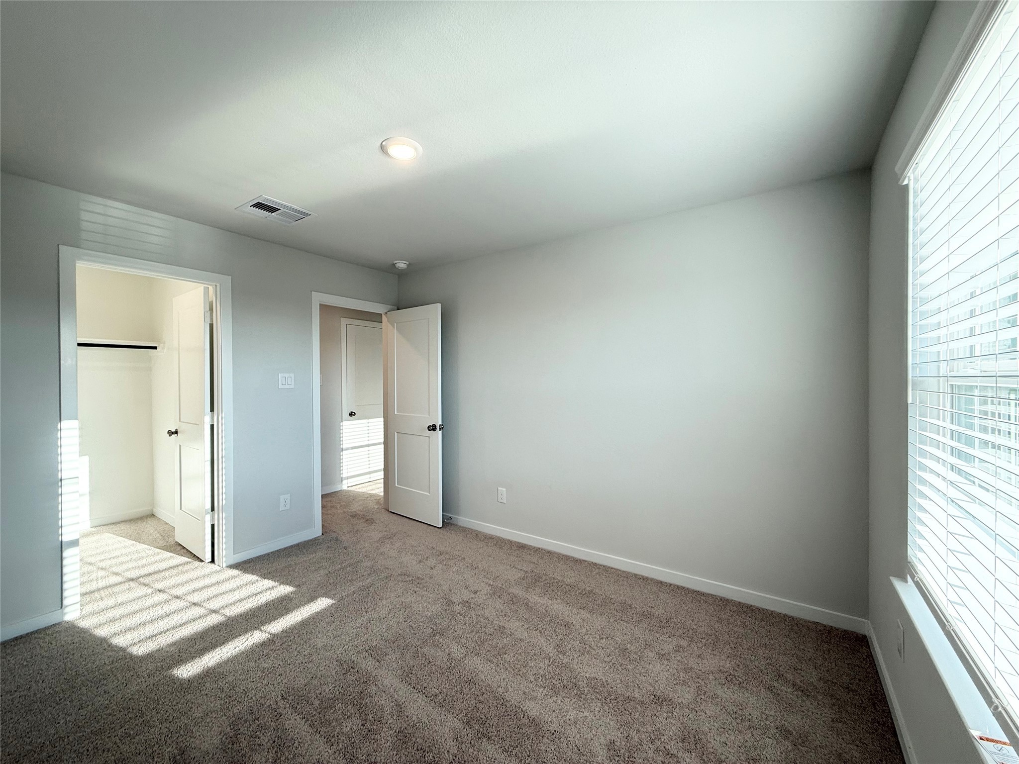 3914 Flora Fld Drive Brookshire, TX 77423 - Photo 25 of 32 an empty room with windows and closet