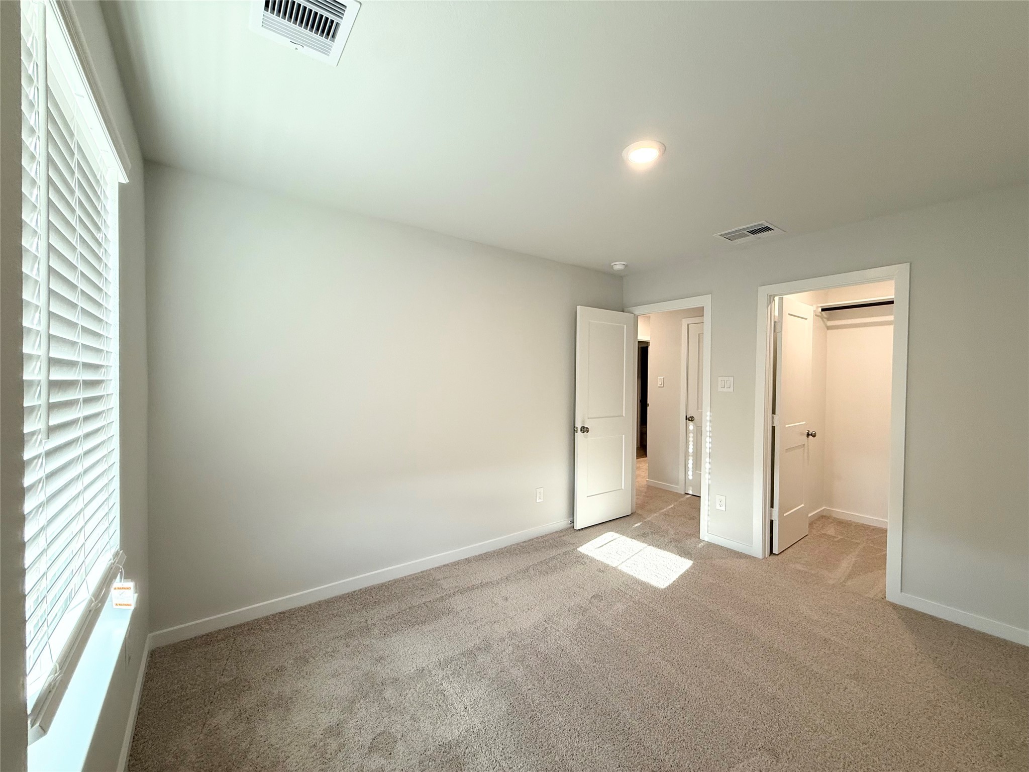 3914 Flora Fld Drive Brookshire, TX 77423 - Photo 28 of 32 an empty room with a empty space and windows
