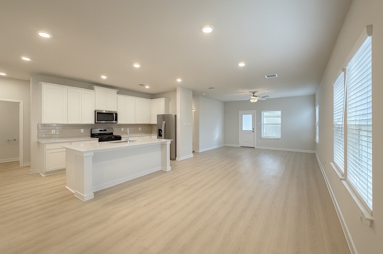 3914 Flora Fld Drive Brookshire, TX 77423 - Photo 5 of 32 a view of kitchen with granite countertop lots of counter top space and stainless steel appliances