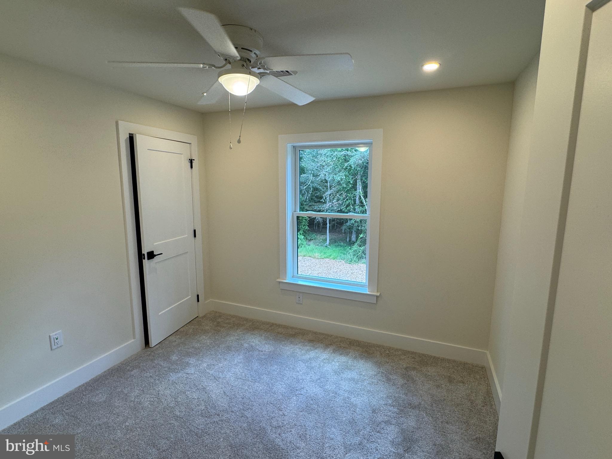14 Wynn Road Tabernacle, NJ 08088 - Photo 27 of 33 an empty room with a ceiling fan and a window