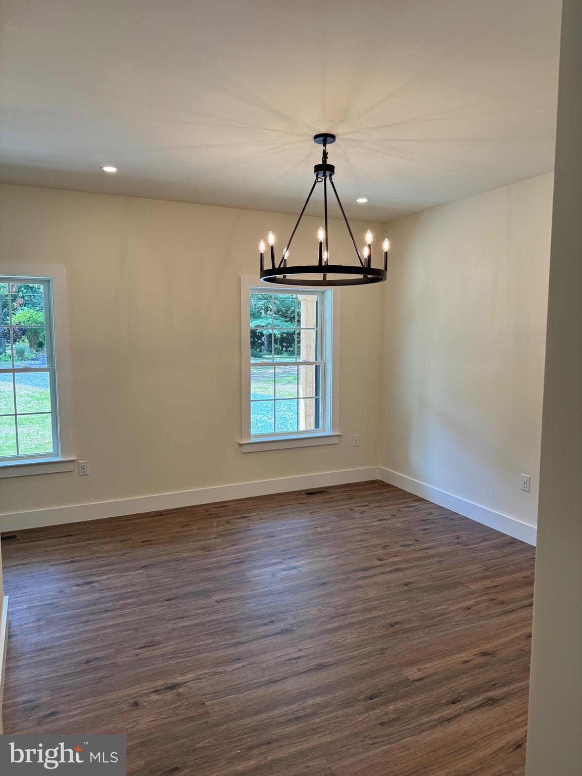 14 Wynn Road Tabernacle, NJ 08088 - Photo 10 of 33 an empty room with wooden floor ceiling fan and windows