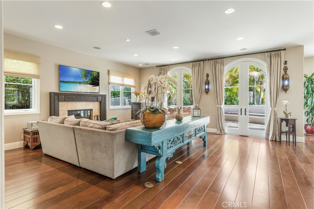 1716 Addison Road Palos Verdes Estates, CA 90274 - Photo 11 of 55 a living room with furniture large windows and a fireplace