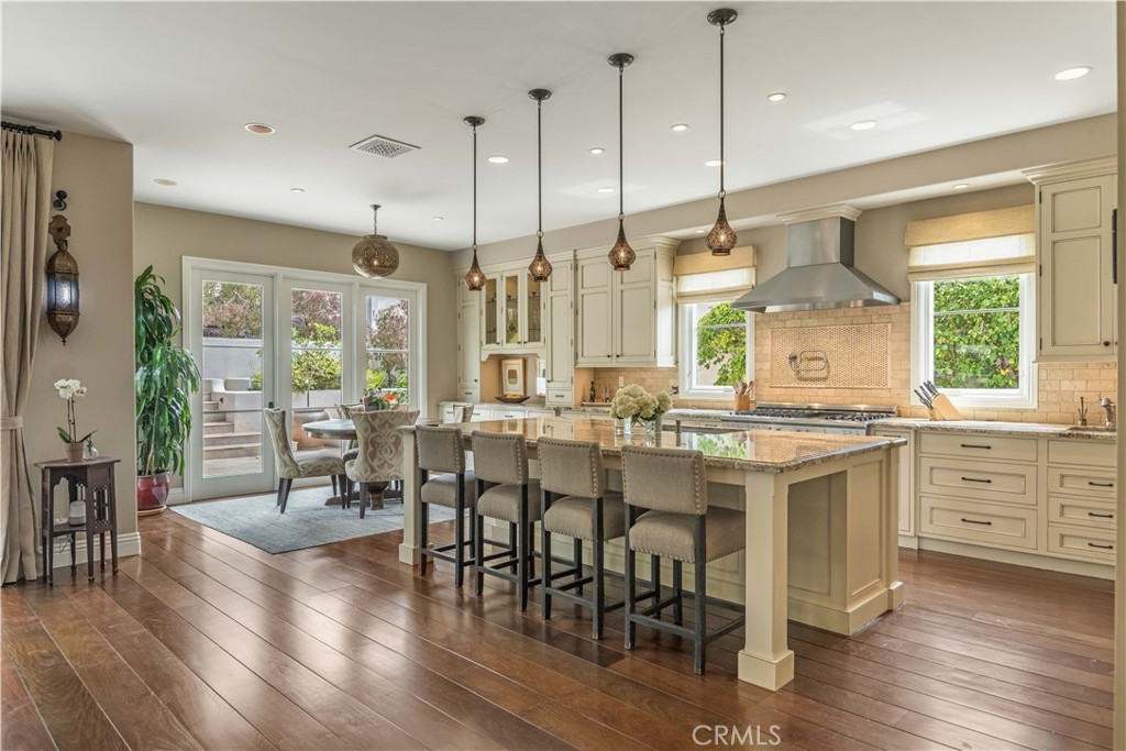 1716 Addison Road Palos Verdes Estates, CA 90274 - Photo 12 of 55 a large kitchen with lots of counter space dining table and stainless steel appliances