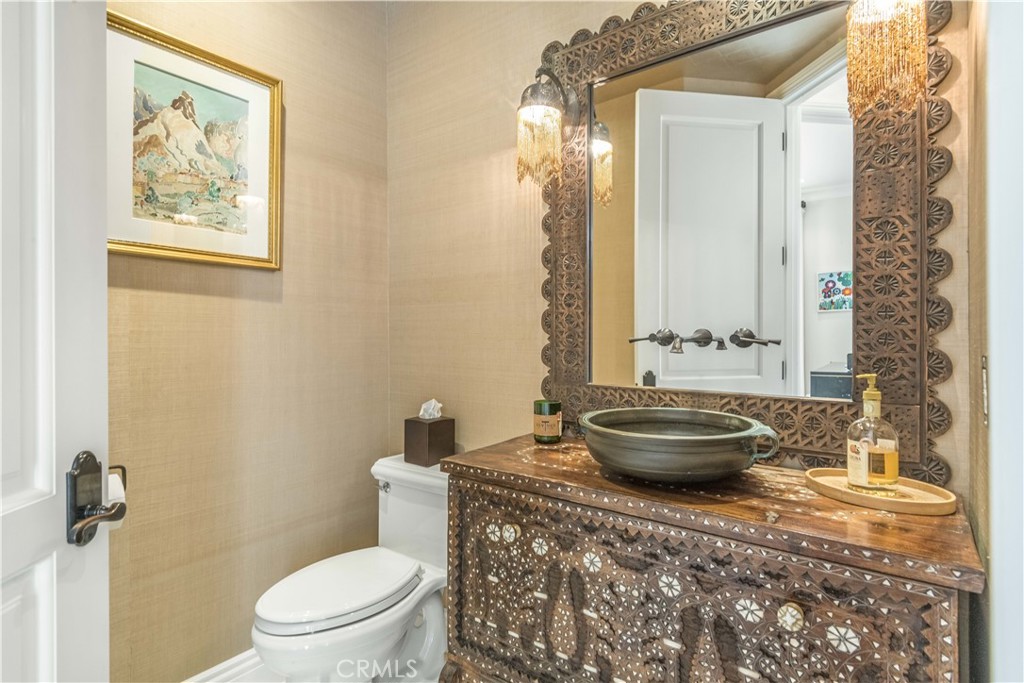 1716 Addison Road Palos Verdes Estates, CA 90274 - Photo 20 of 55 a bathroom with a granite countertop toilet and a sink