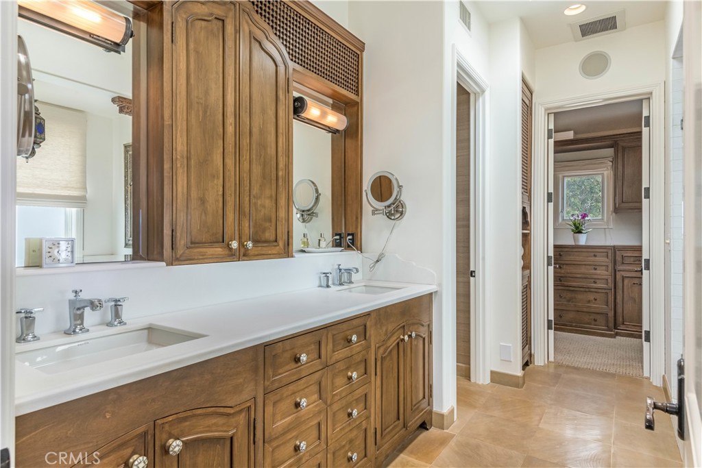 1716 Addison Road Palos Verdes Estates, CA 90274 - Photo 24 of 55 a bathroom with a granite countertop sink and a mirror