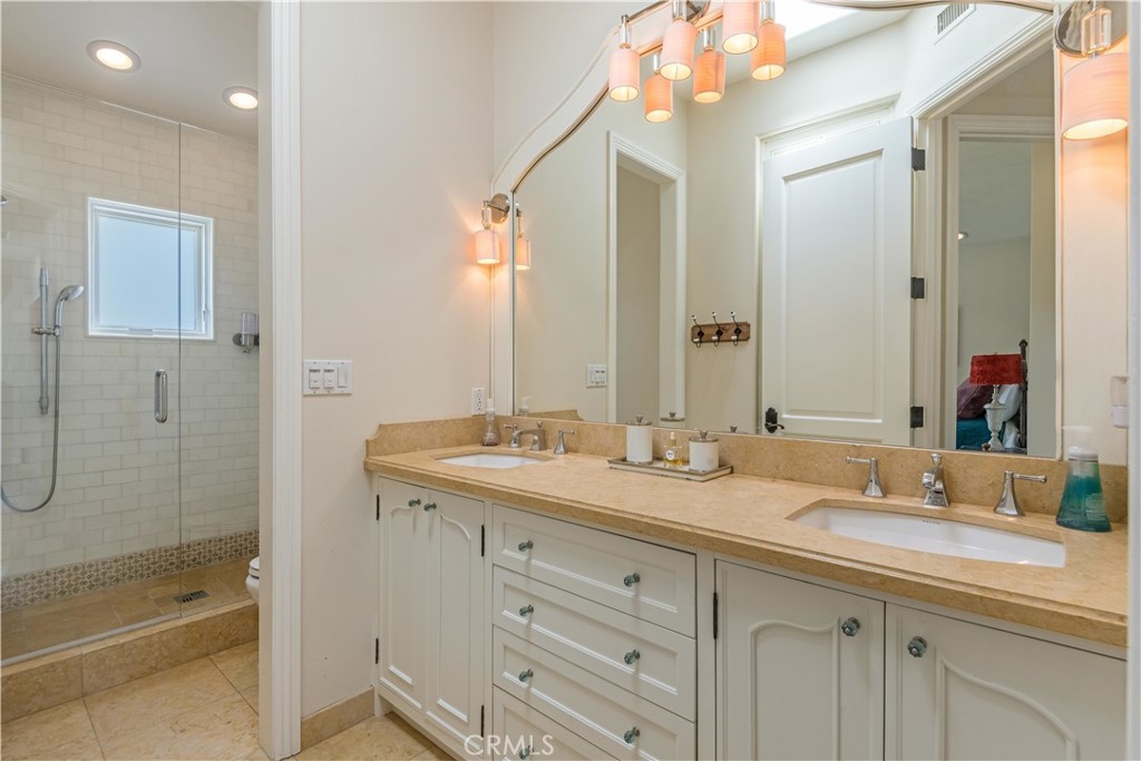 1716 Addison Road Palos Verdes Estates, CA 90274 - Photo 29 of 55 a bathroom with a granite countertop sink mirror and double