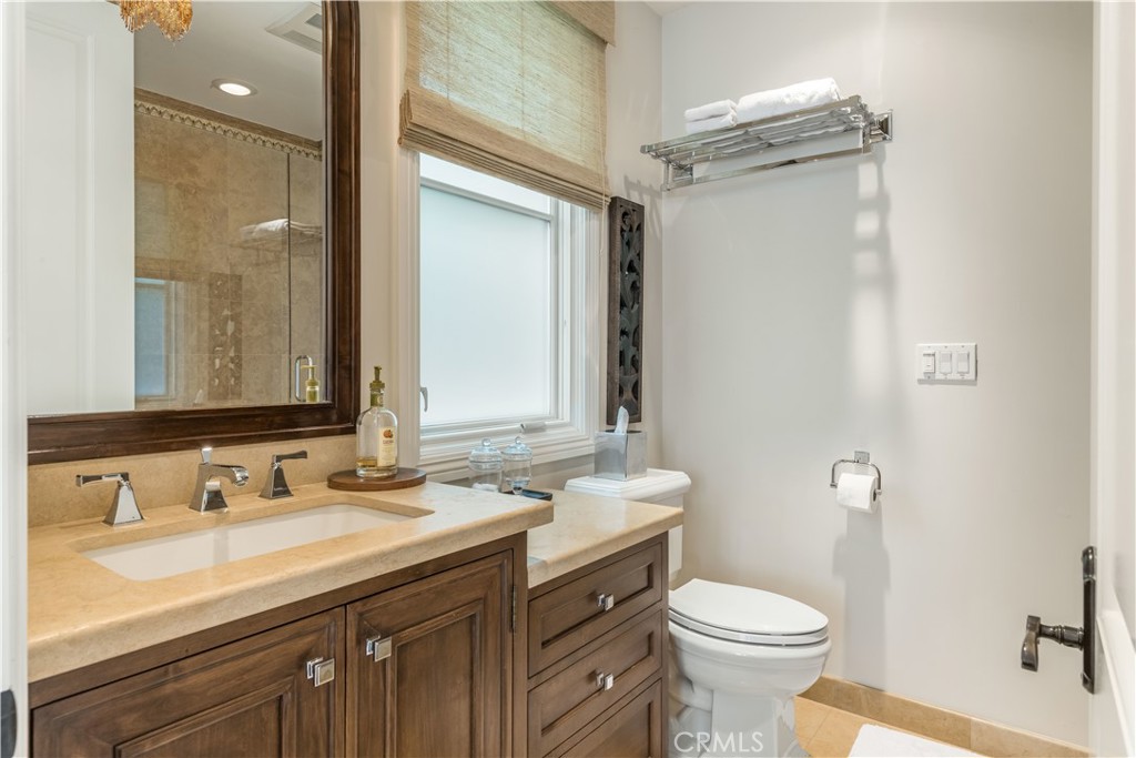 1716 Addison Road Palos Verdes Estates, CA 90274 - Photo 33 of 55 a bathroom with a granite countertop sink toilet and shower