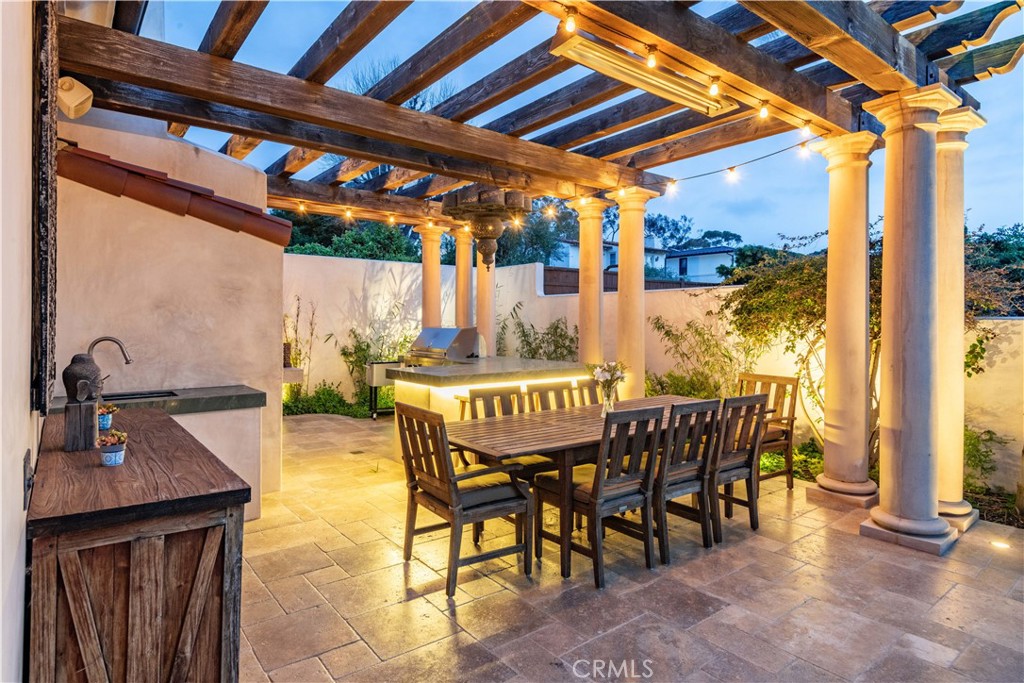 1716 Addison Road Palos Verdes Estates, CA 90274 - Photo 40 of 55 a patio with table and chairs and potted plants